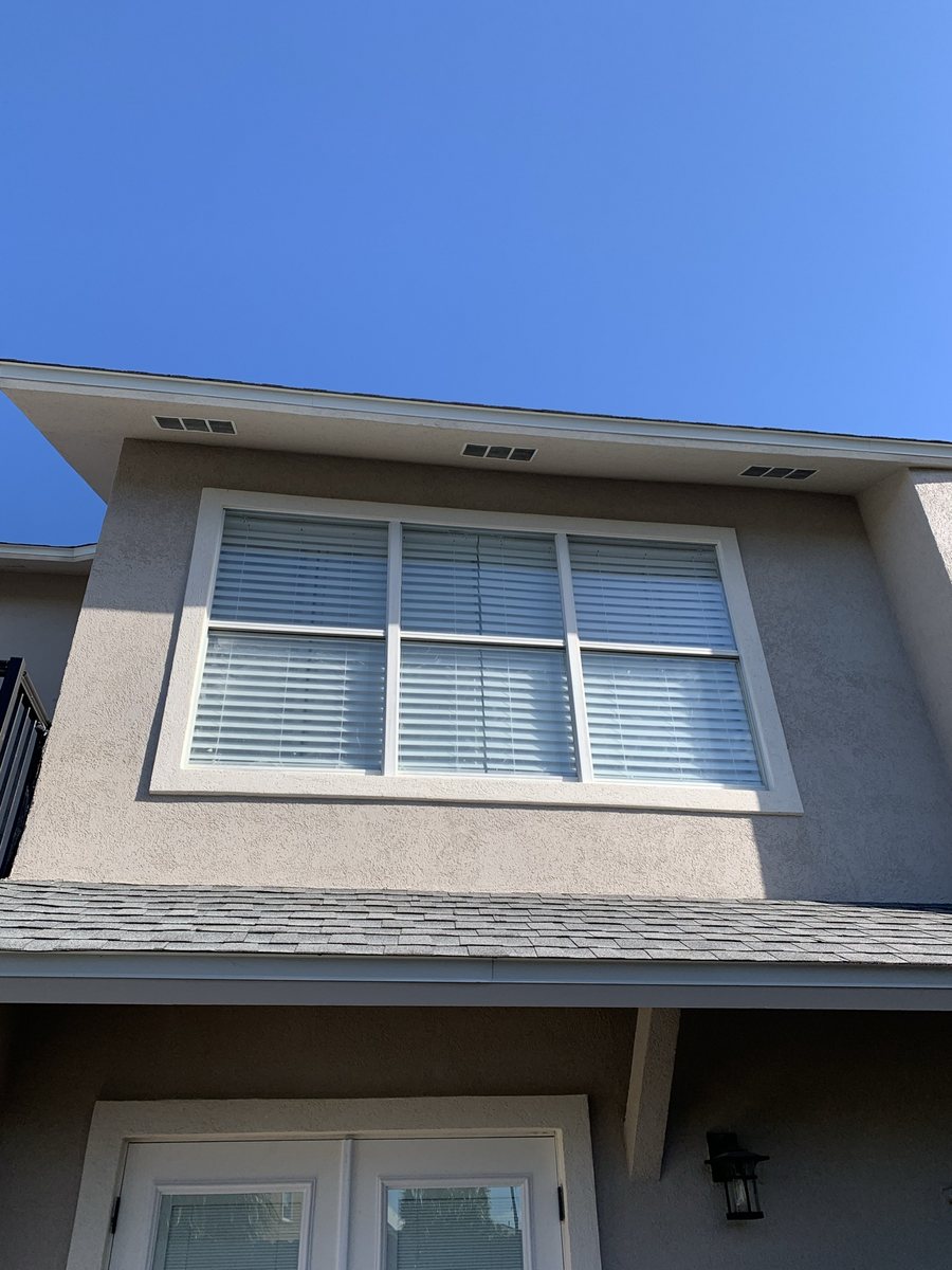 Home exterior with repaired, refinished stucco